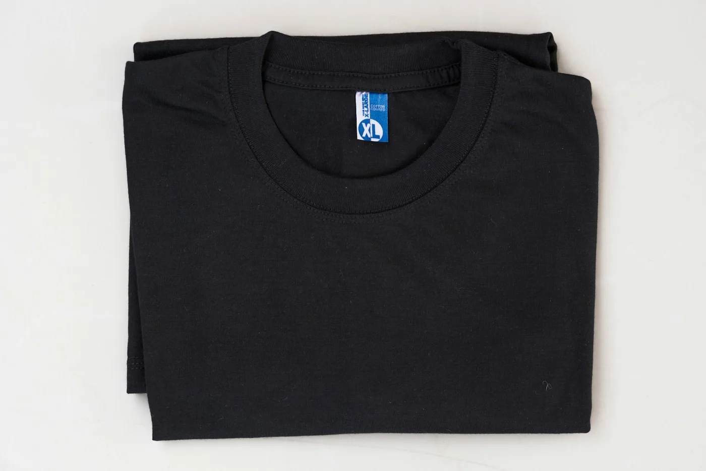 Stack of folded blank t-shirts